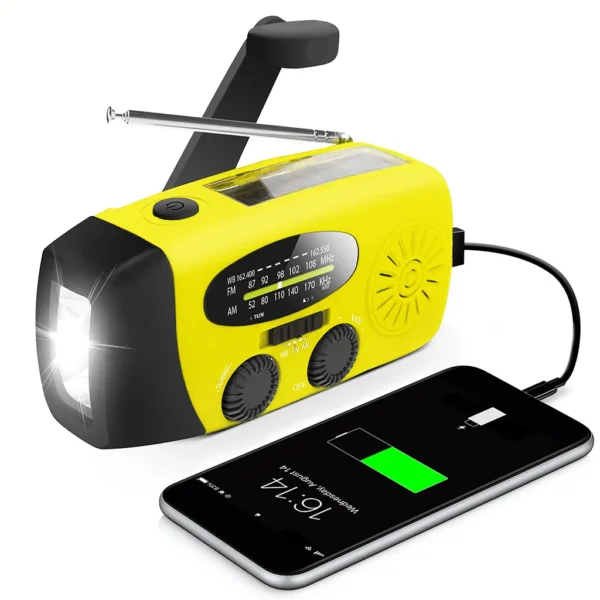 A yellow emergency weather radio with a hand-crank and solar panel is actively charging a smartphone, set against a clean white background.