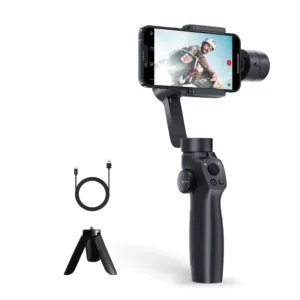 3-axis gimbal stabilizer holding a smartphone displaying a skateboarder, shown with its mini tripod and USB charging cable.